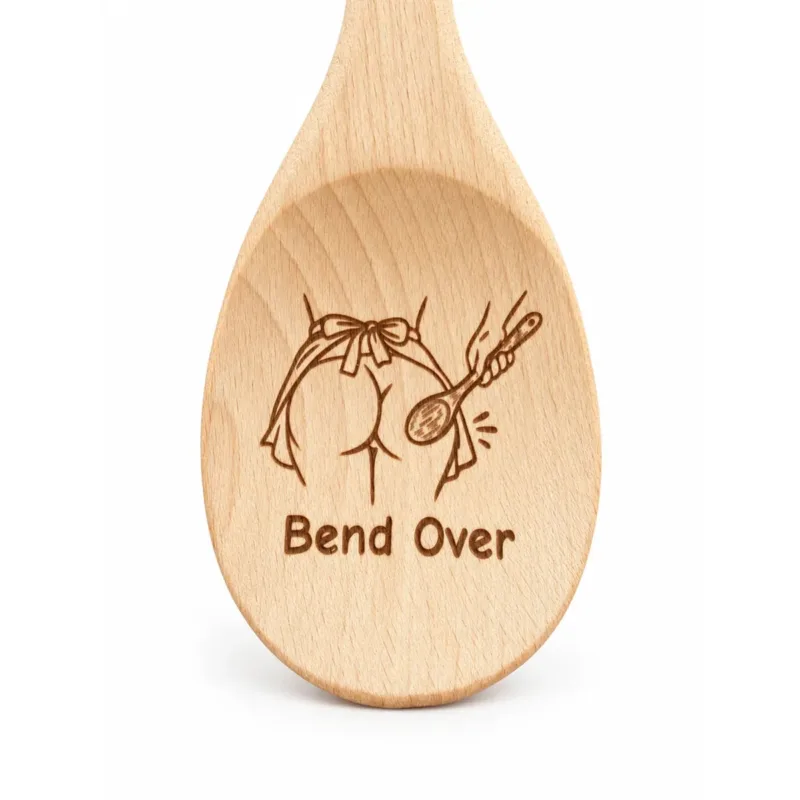 Bend Over engraved wooden spoon, close-up of the engraved bowl on a white background