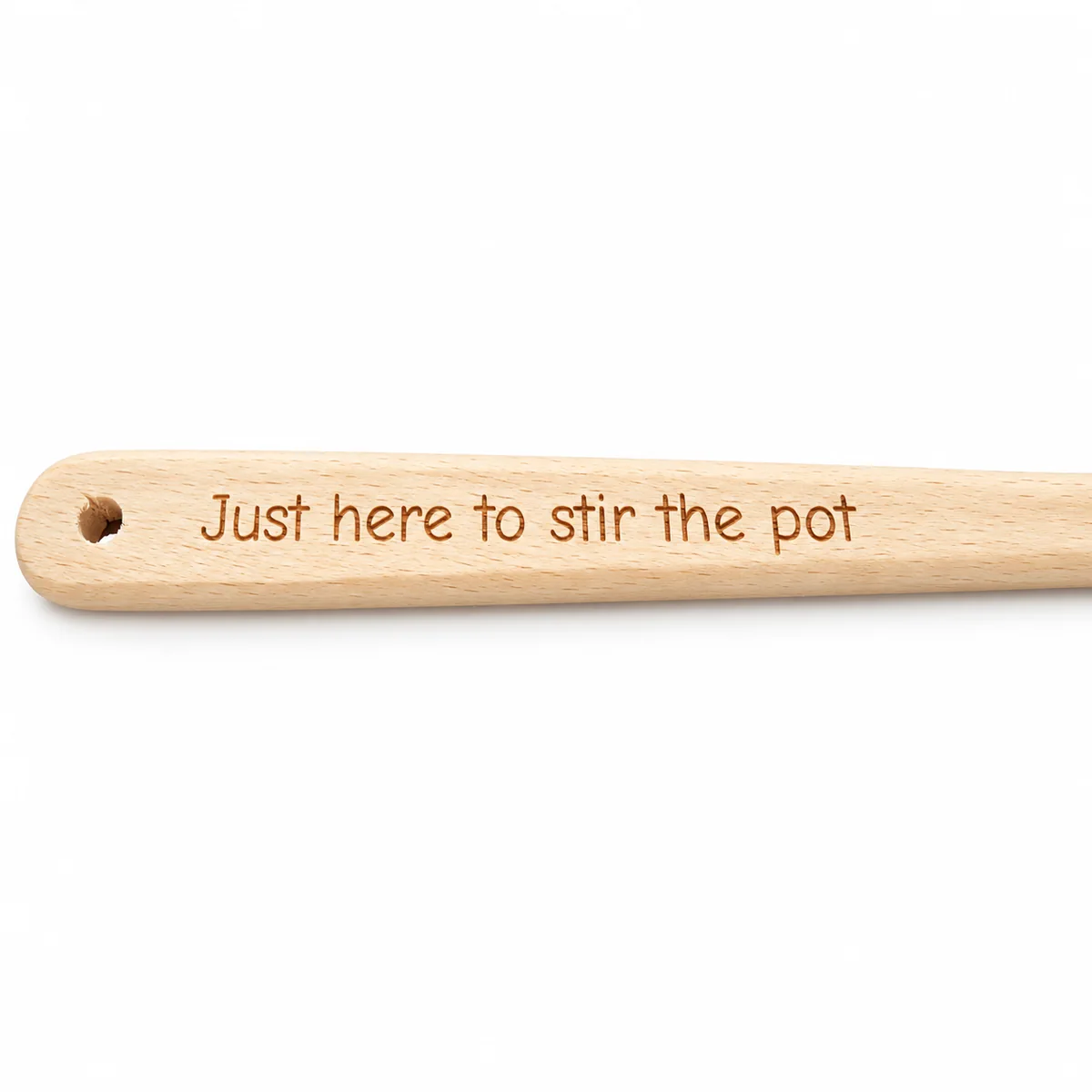 Personalised Handle Engraved Wooden Spoon, close-up of example Just here to stir the pot text engraved along the handle, white background