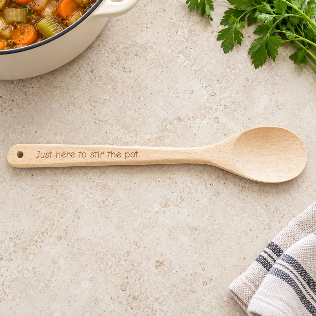 Personalised Handle Engraved Wooden Spoon, on a limestone kitchen tabletop