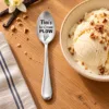 Personalised Ice Cream Plow Spoon beside a bowl of vanilla ice cream.