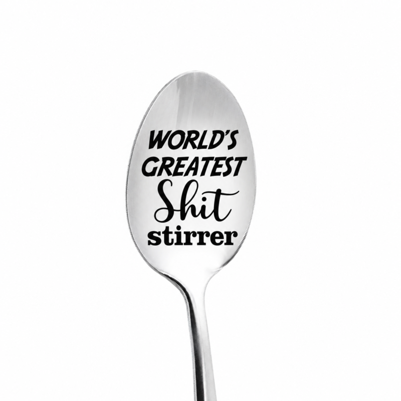 Stainless steel spoon with World’s Greatest Shit Stirrer lettering engraved on the bowl