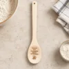 You’re My Favourite Shit Stirrer Engraved Wooden Spoon, on a limestone kitchen tabletop