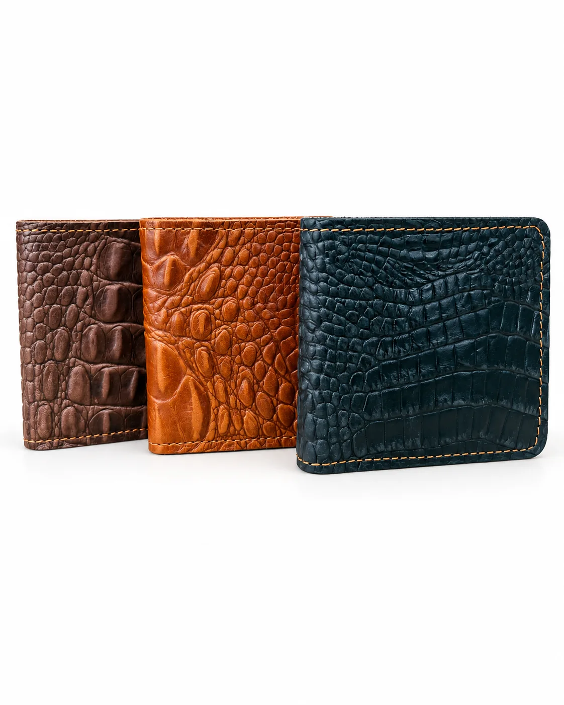 Dark brown, tan and black crocodile-pattern wallets standing together on a white background