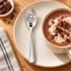 Personalised Milo Spoon beside a cup of hot chocolate.